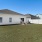 a house with a lawn in front of it