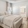a bedroom with a bed and a chair