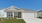 a house with garages and grass