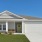 a house with garages and grass
