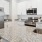 a kitchen with marble counters
